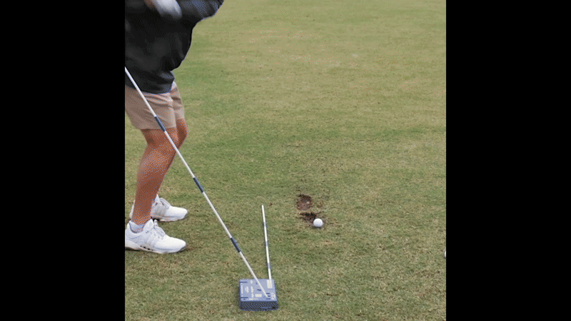 Tour pro demonstrating swing with the Blue Brick training aid
